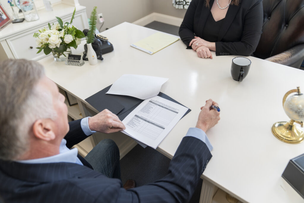 Person reviewing documents with a Nebraska divorce attorney